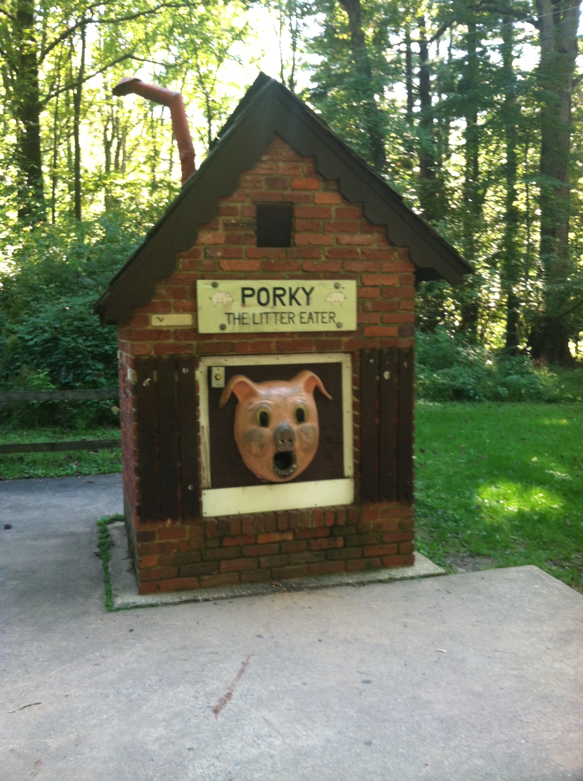 Porky the Litter Eater at Cabin John Park, a giant disembodied pig head mounted on a little brick building.