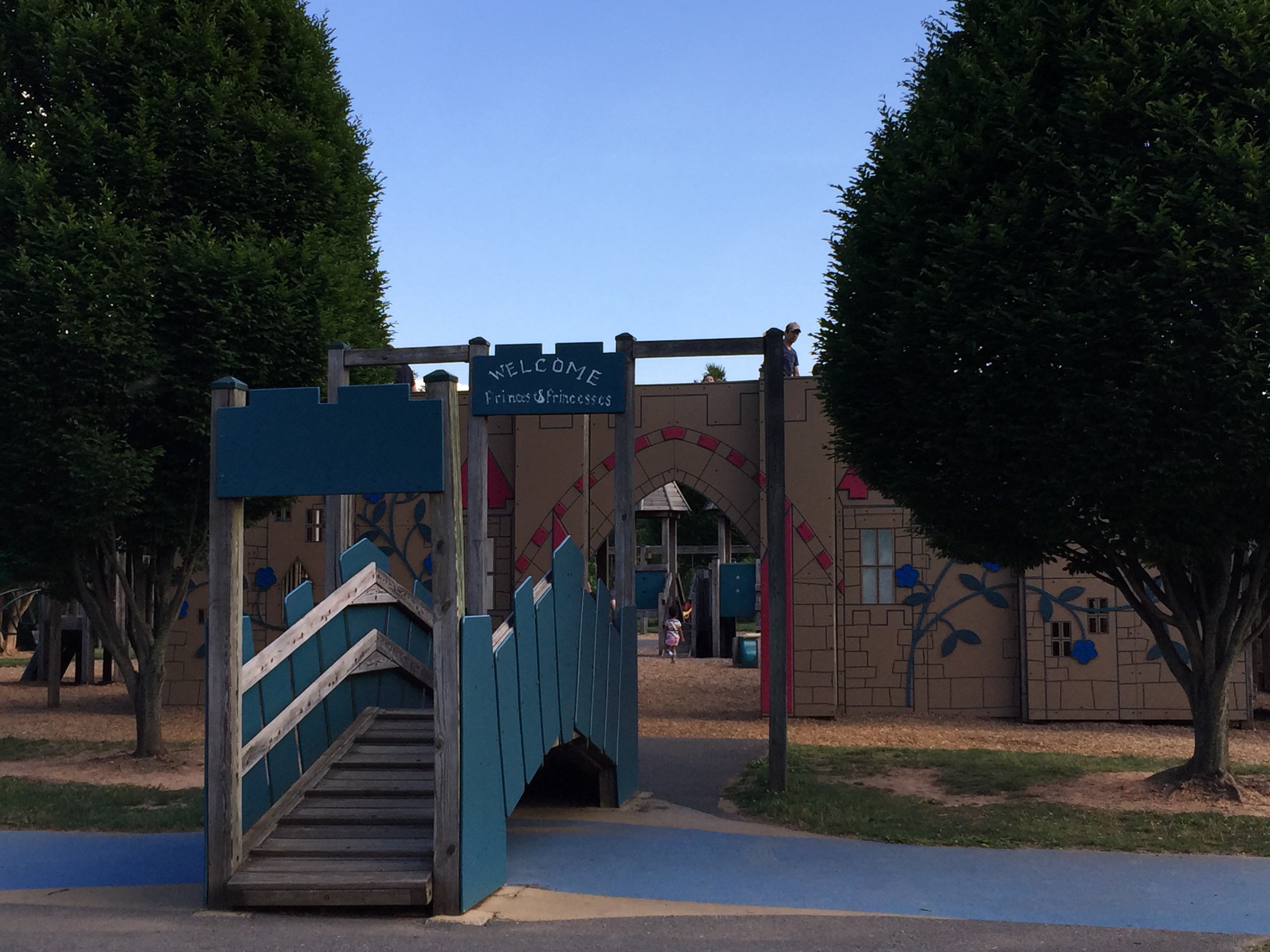 A mock bridge over a moat and castle structure at the South Germantown Adventure Playground